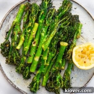 Crispy Air-Fried Tenderstem Broccoli 8 Air Fryer Tenderstem Broccoli served on a plate.