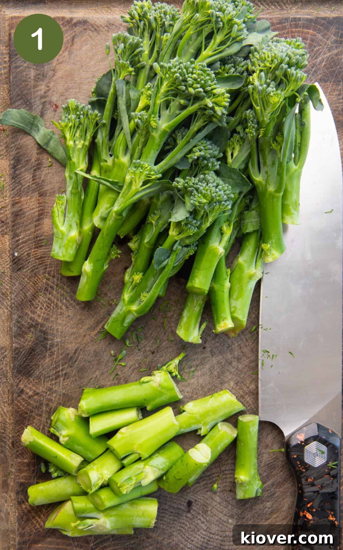 Crispy Air-Fried Tenderstem Broccoli 4 Broccoli florets on a wooden cutting board, with stems trimmed.