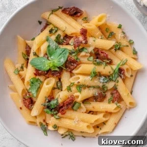 Sun dried tomato pasta with fresh basil and parmesan cheese.