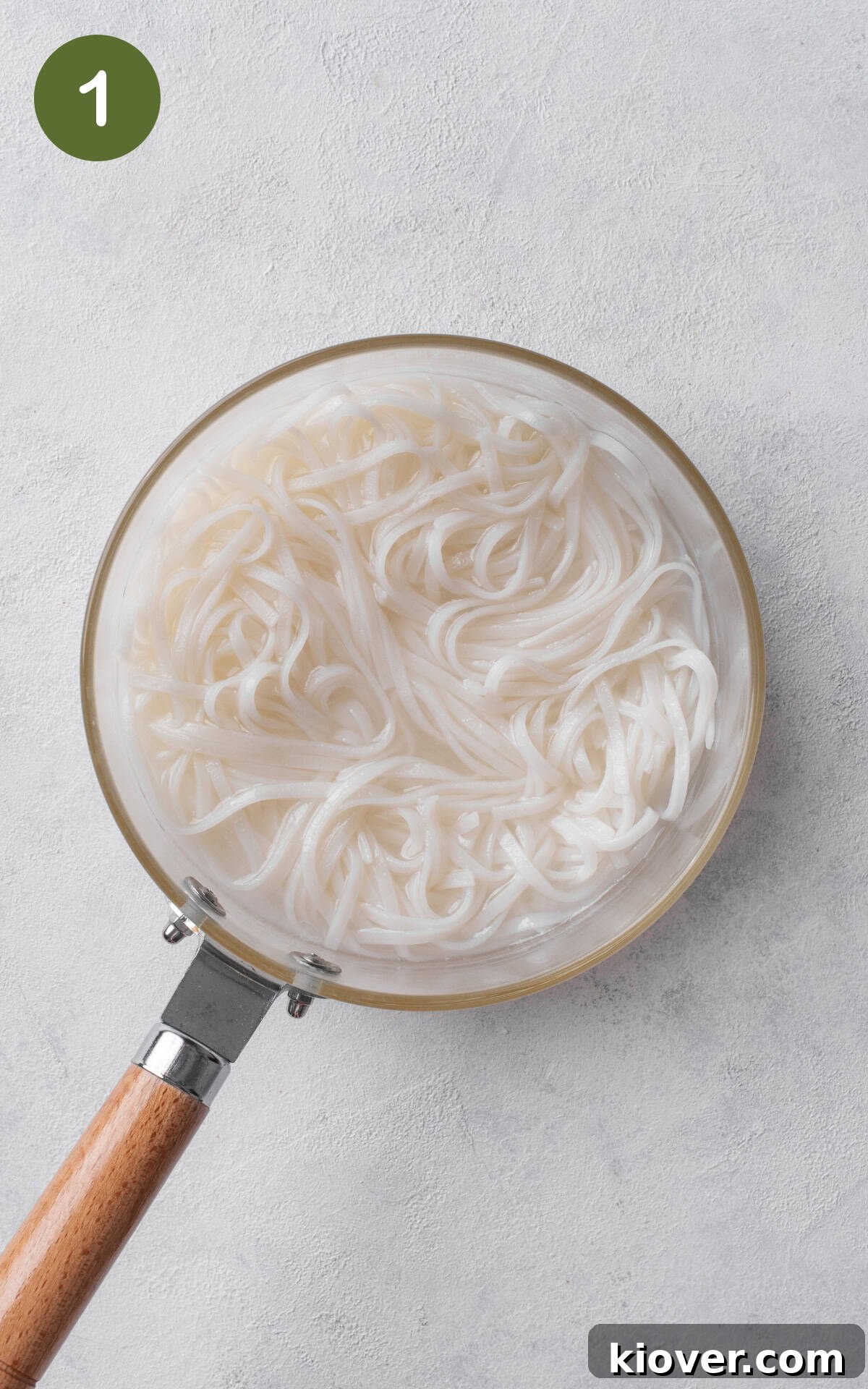 Savory Prawn Noodles 4 rice noodles in a pot.
