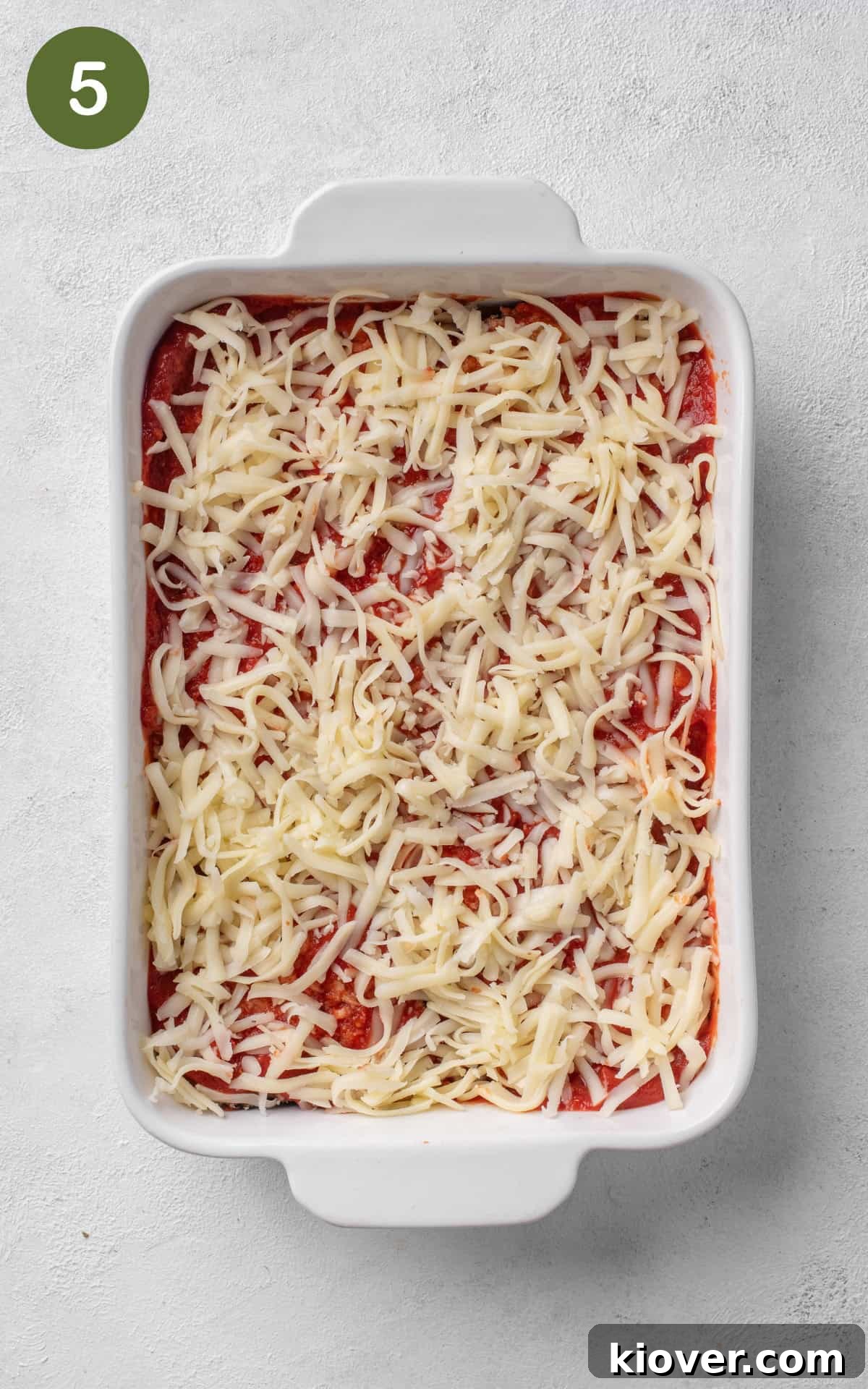Italian Eggplant Comfort Bake 8 aubergines in a baking dish topped with cheese.