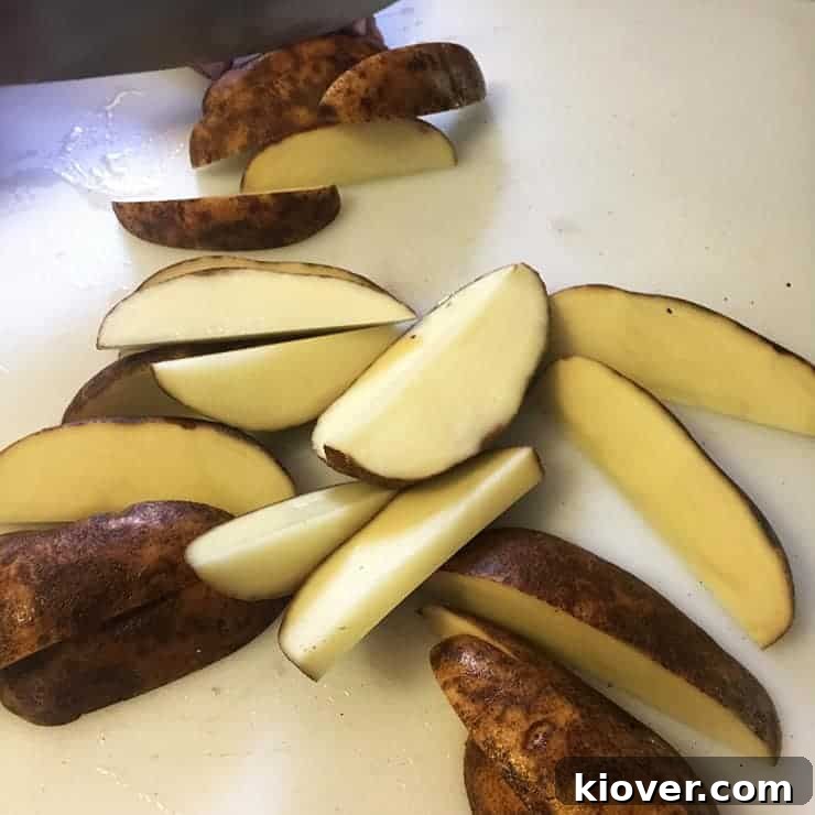 Cut Potatoes potatoes cut into wedges before they are boiled or grilled. Just to show the approximate size of these bad boys.