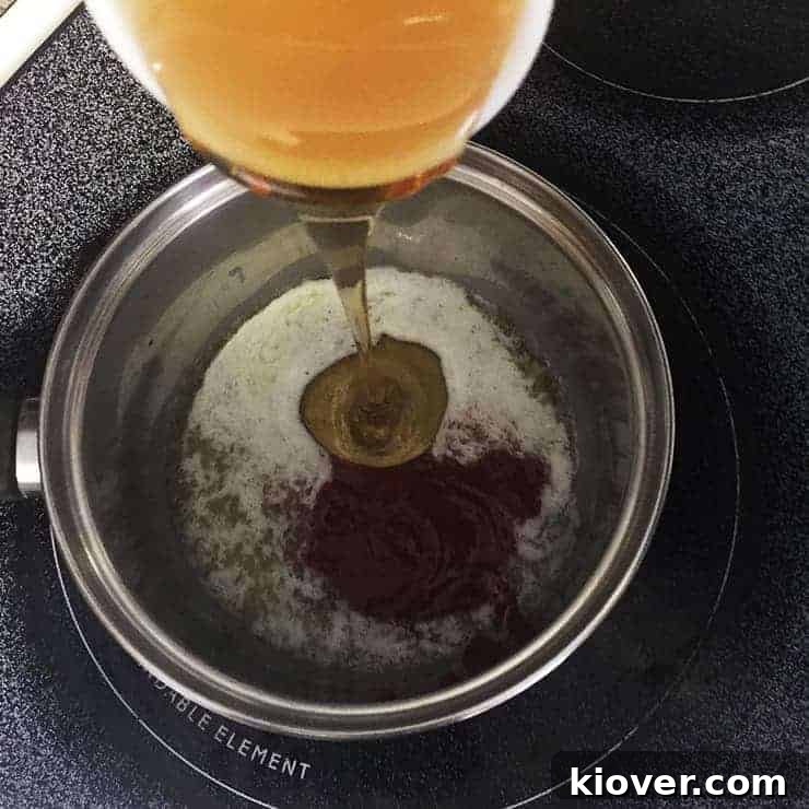 combining the ingredients for the honey sriracha glaze