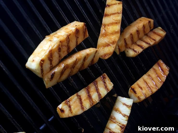 Grilling pineapple with good grill marks on one side