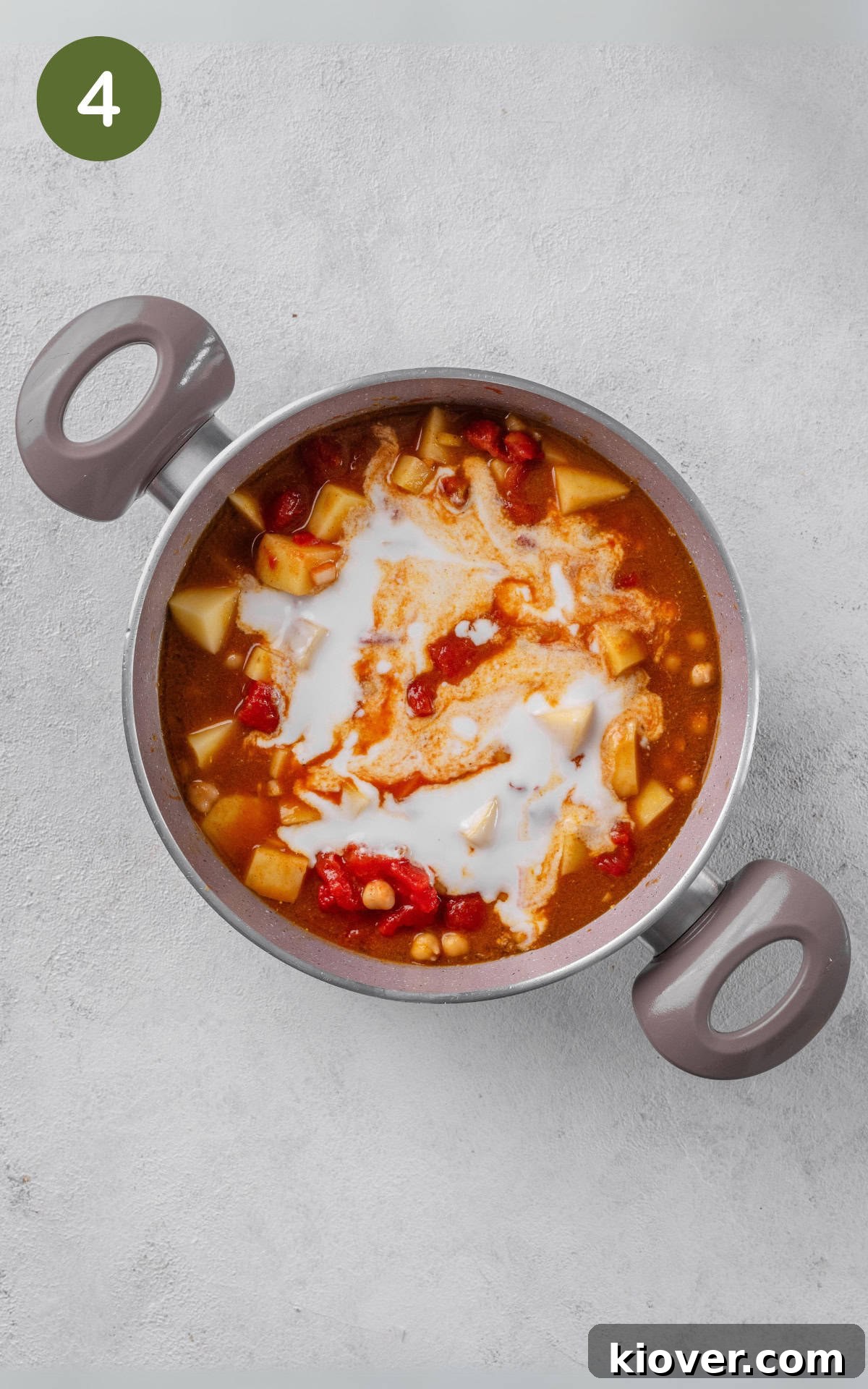 Golden Potato Curry 7 Potatoes, chickpeas, vegetable broth, chopped tomatoes, and coconut milk simmering together in a saucepot.