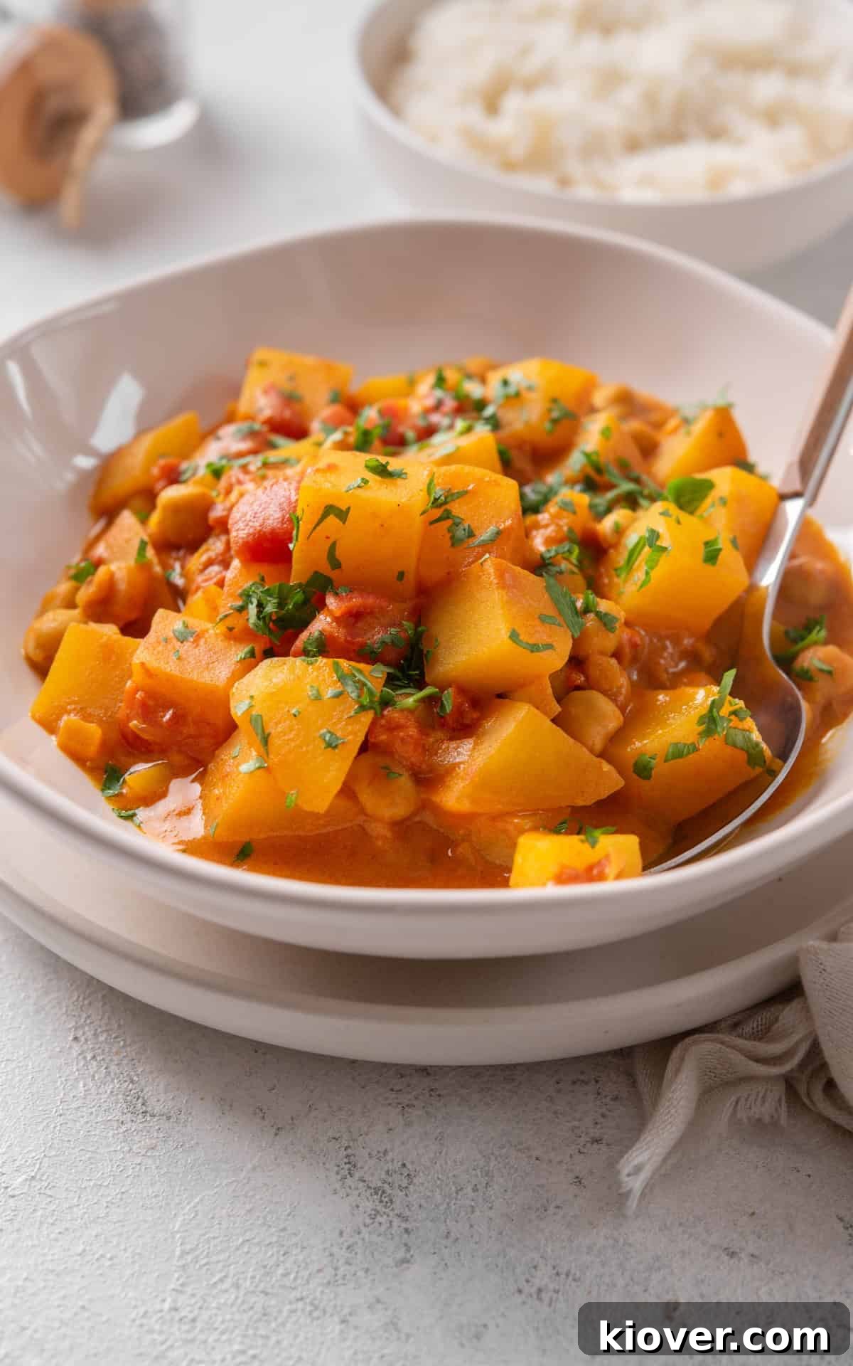 Golden Potato Curry 8 Beautifully garnished potato curry (aloo curry) with fresh herbs, ready to be enjoyed.