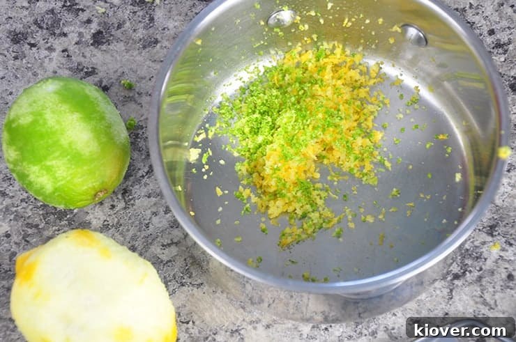Lemon and lime zest being prepared in a pan for homemade tonic syrup