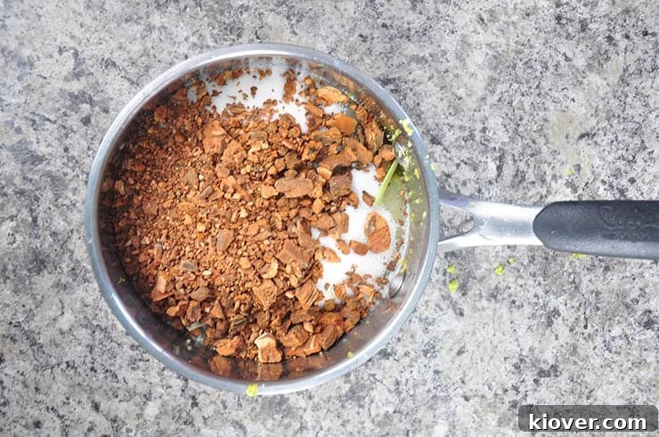 Cinchona bark and sugar in a pan, ready for the tonic syrup cooking process