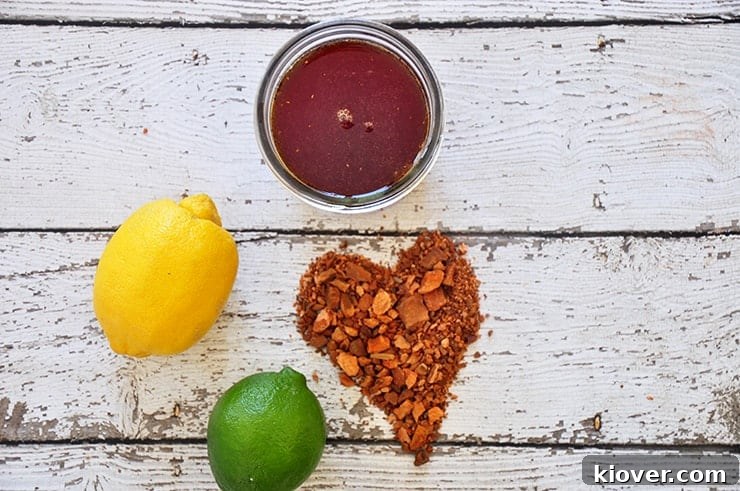 Overhead shot of tonic syrup in a jar, surrounded by cinchona bark arranged into a heart shape, symbolizing passion for homemade beverages.