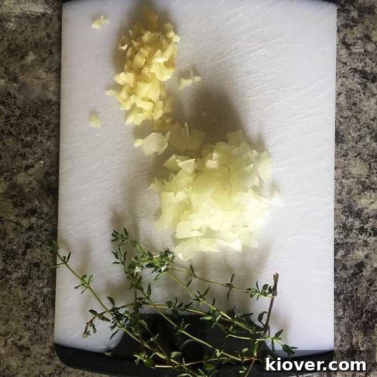 Chopped Garlic and Onions Thyme, garlic, and onions for pizza sauce, neatly chopped and ready.