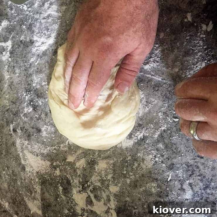 Working Pizza Dough Pizza dough after rising and placed on a floured surface, ready to be stretched.