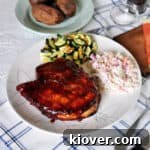 How to grill pork chops finished plate. A thick pork chop with coleslaw and zuchinni