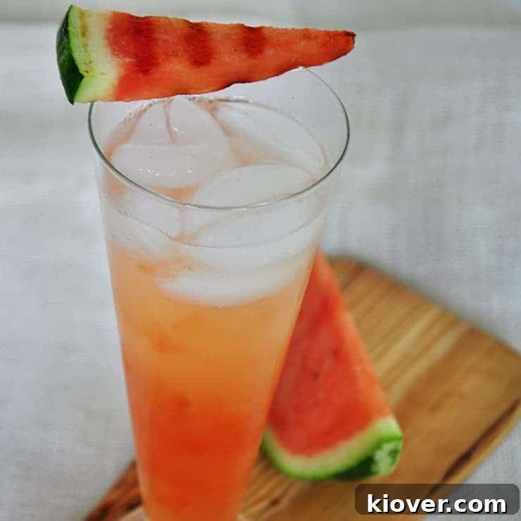 A vibrant Ginger Syrup and grilled watermelon cocktail, garnished and ready to serve