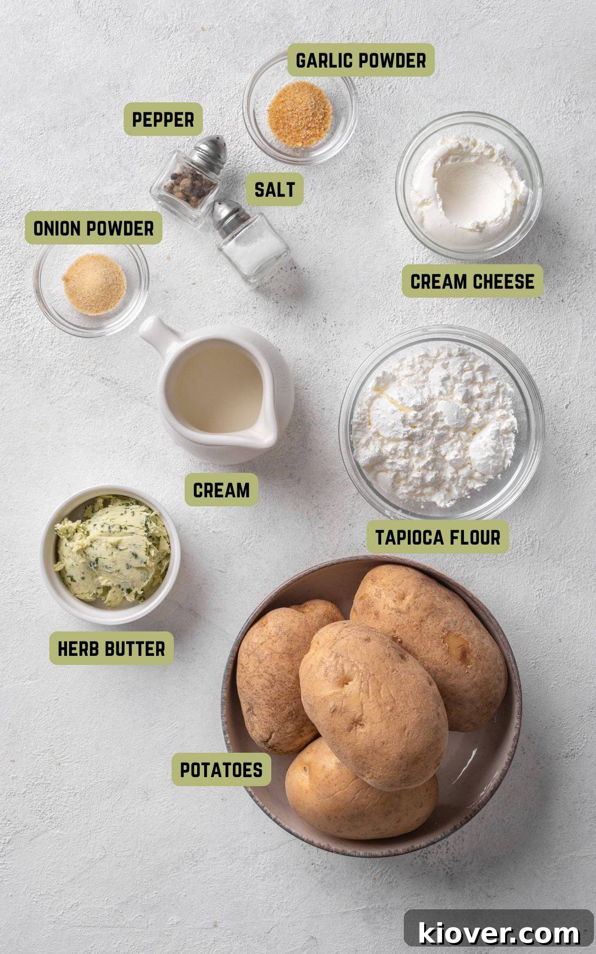 Golden Potato Waffles 3 A collection of fresh ingredients laid out, including potatoes, butter, garlic and onion powder, cream, cream cheese, and tapioca flour, ready to make potato waffles.