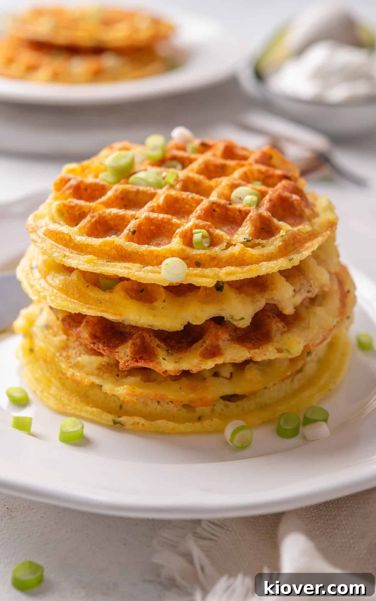 Golden Potato Waffles 10 A stack of golden brown homemade potato waffles, perfectly cooked and ready to be served.
