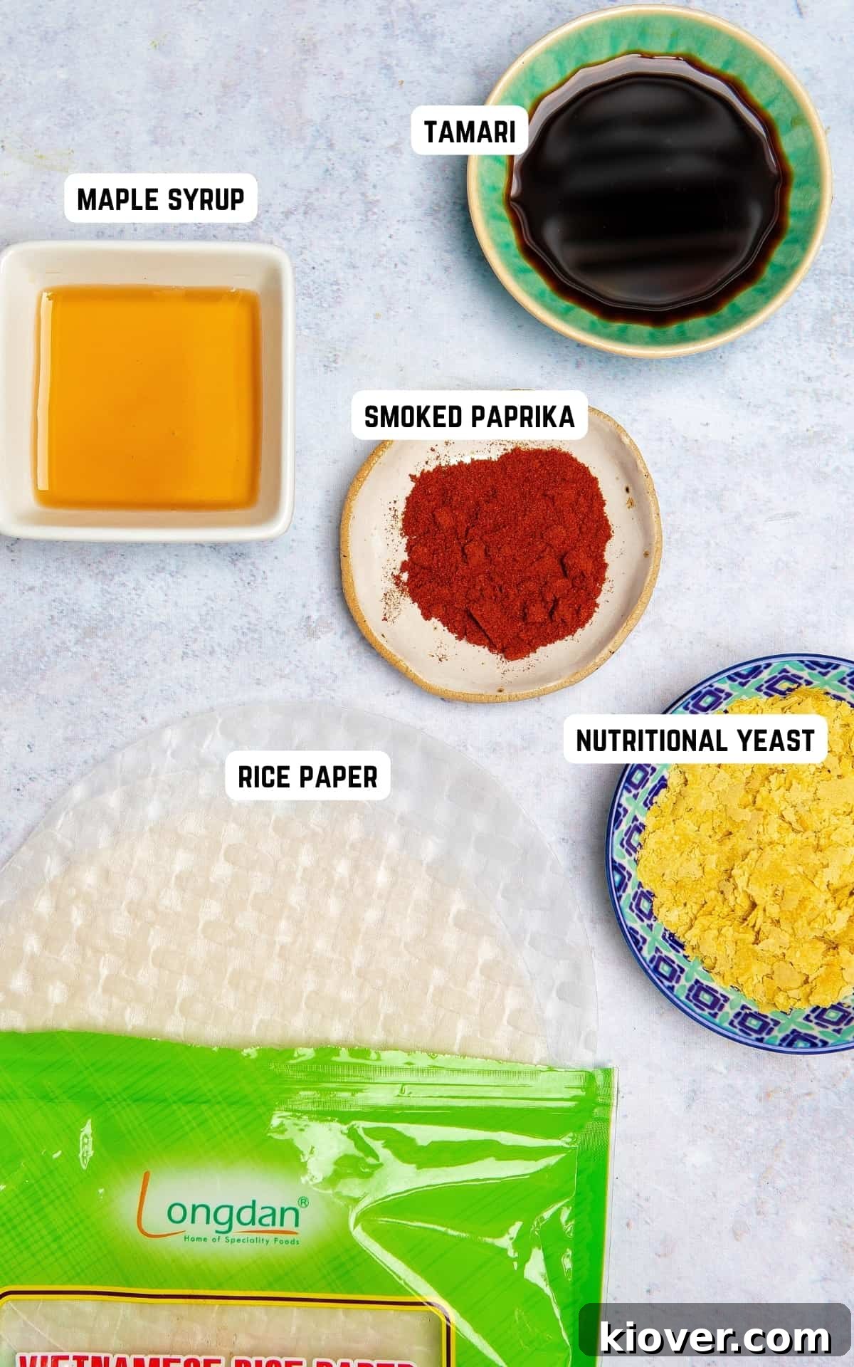 Ingredients laid out for making Rice Paper Bacon: rice paper, tamari, maple syrup, nutritional yeast, and smoked paprika.