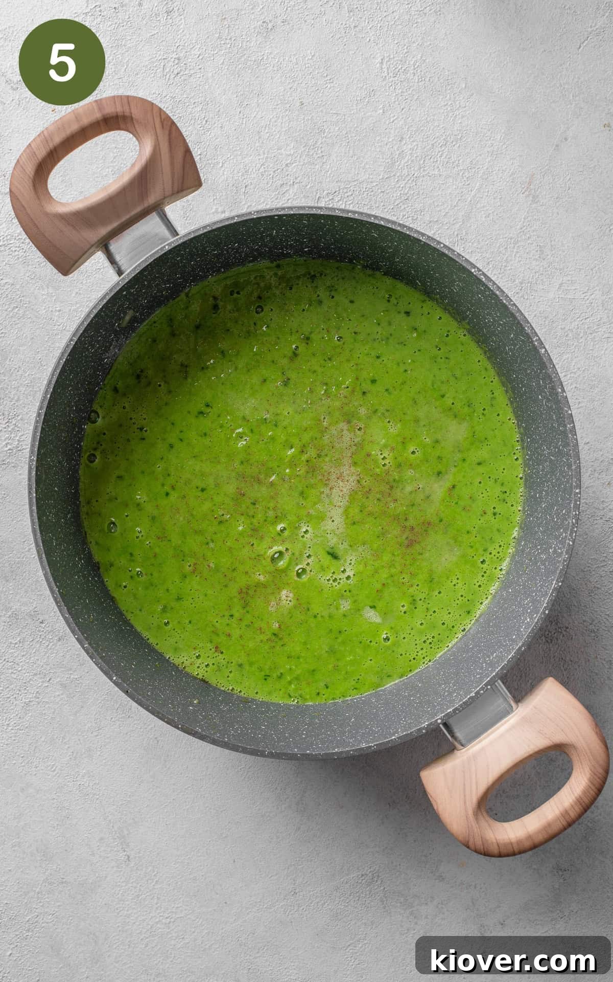 Silky Minted Pea Soup 8 Smooth green pea and mint soup in a saucepot, seasoned with salt and pepper.