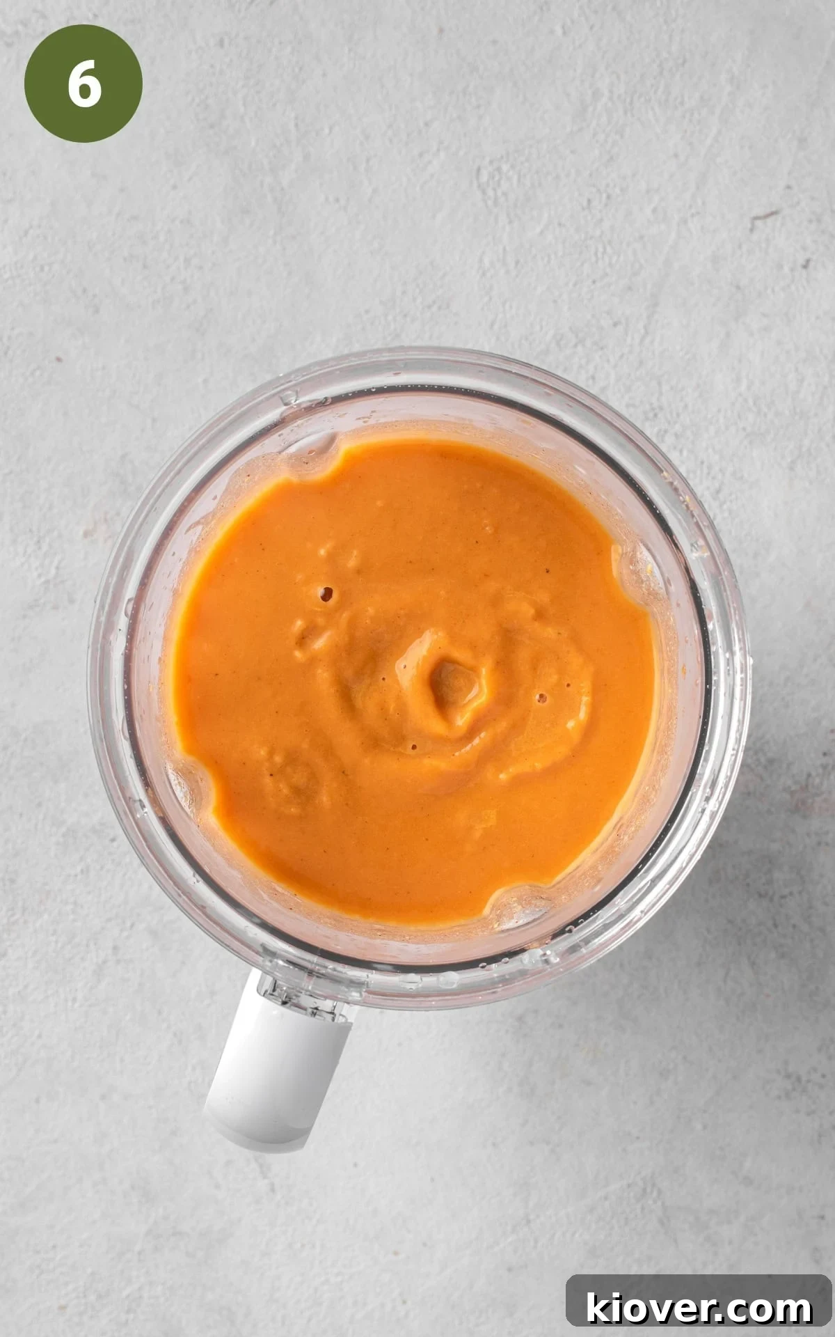 Spiced Sweet Potato Warmth 9 Smooth sweet potato soup being blended in a food processor.