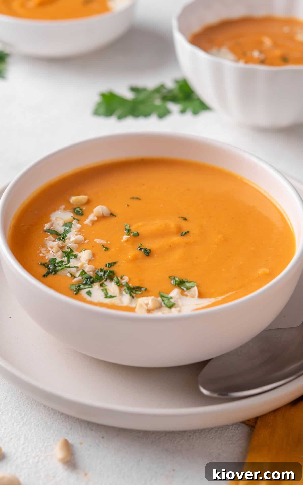 Spiced Sweet Potato Warmth 10 A close-up shot of the blended sweet potato soup with subtle garnishes, highlighting its smooth texture and rich color.