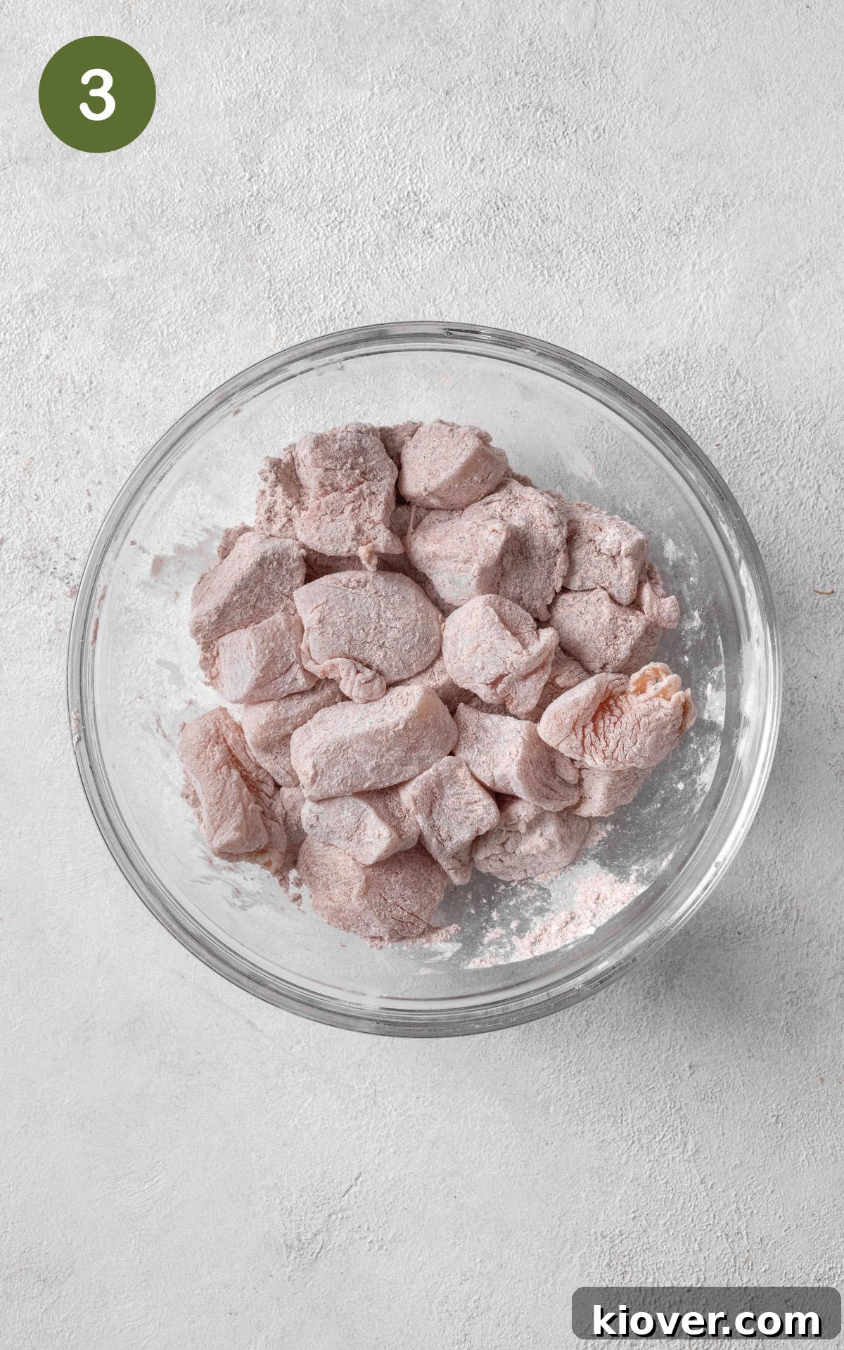 A bowl containing cornstarch and Chinese five-spice powder, perfectly combined, ready to coat the chicken.