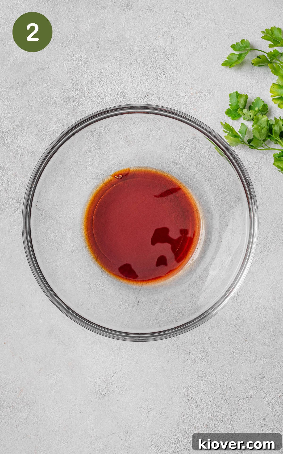 Soy sauce, maple syrup, and sesame seed oil combined in a bowl for the marinade.