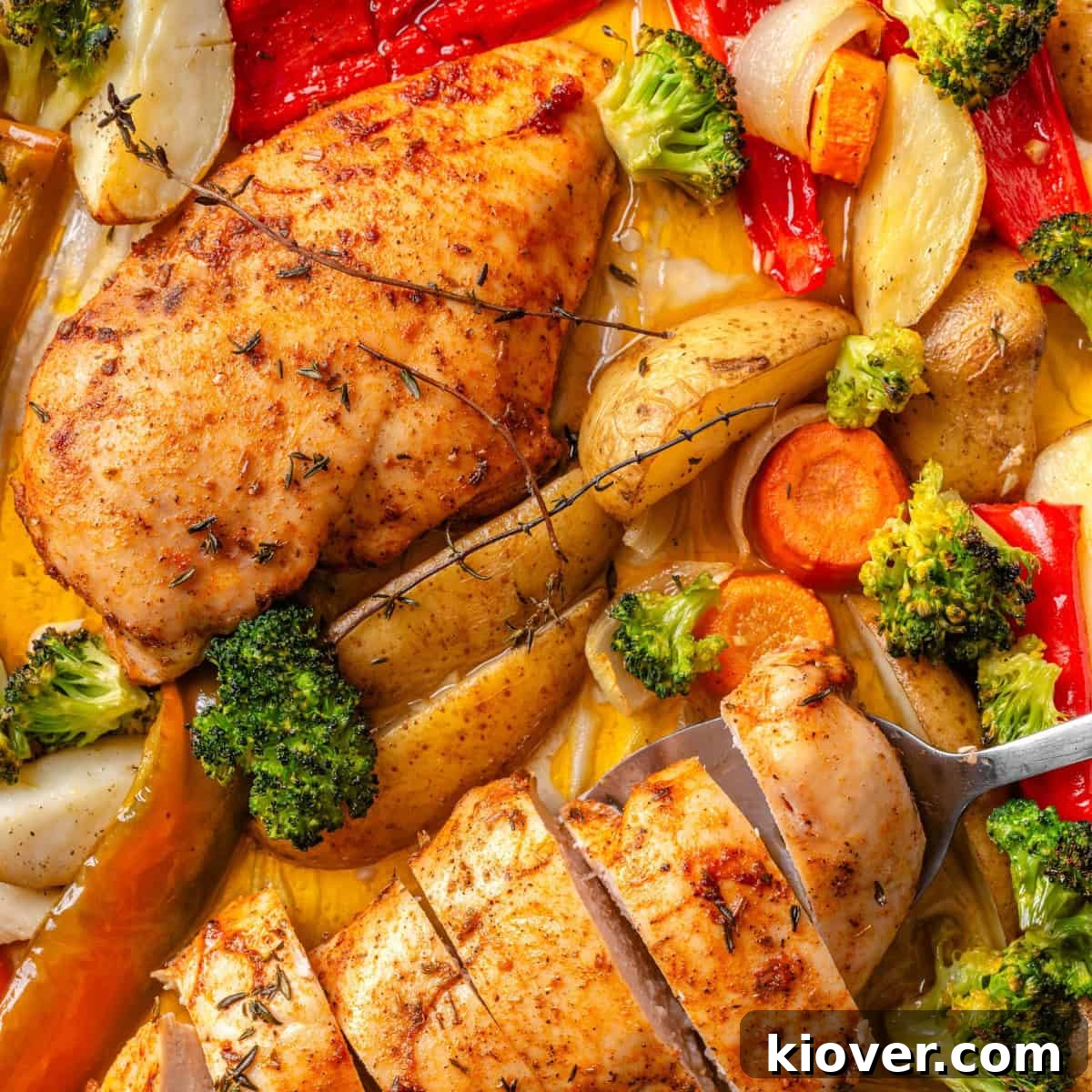 A vibrant and healthy chicken and vegetable traybake, freshly roasted and ready to serve.