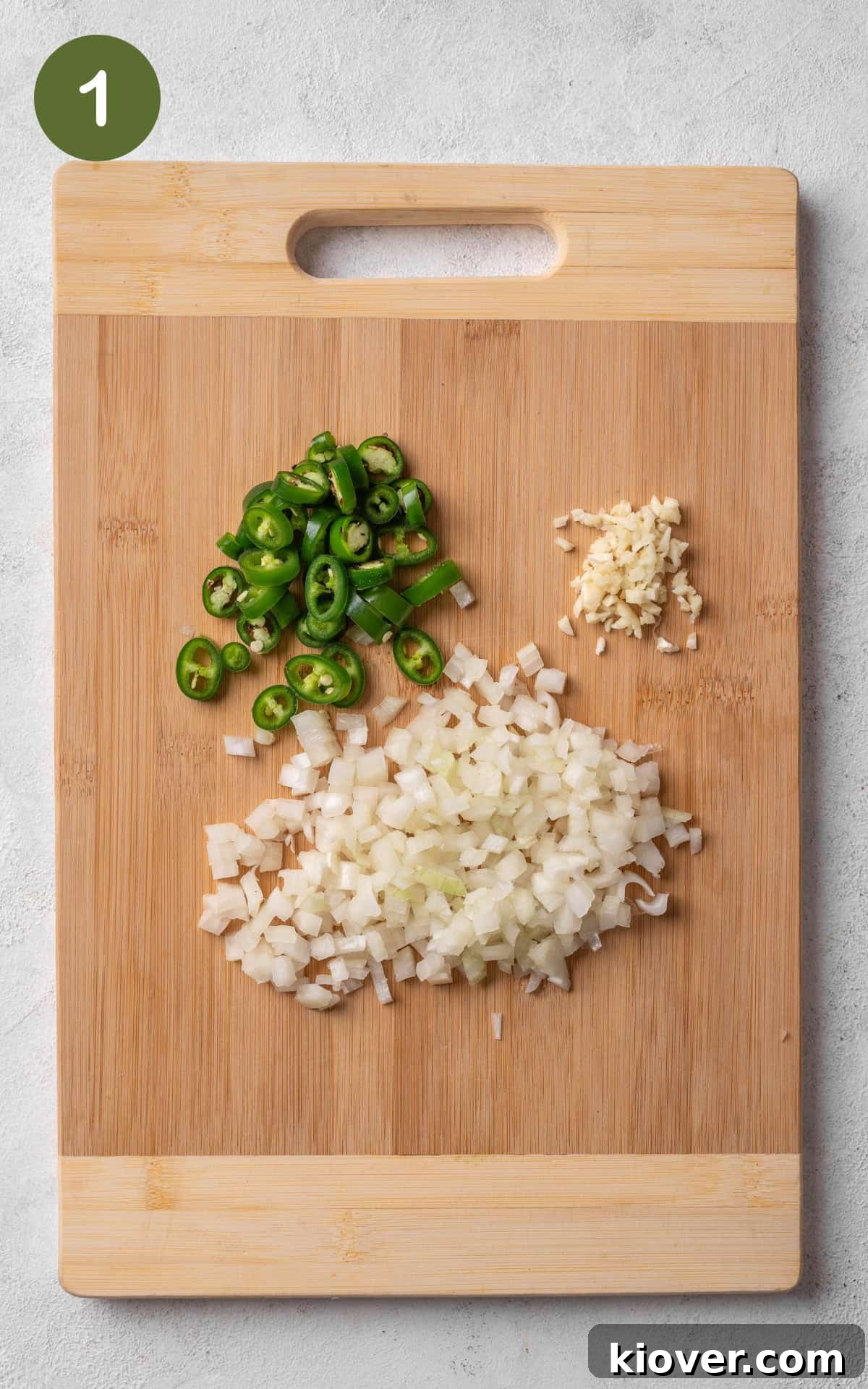Cut up vegetables on a cutting board.