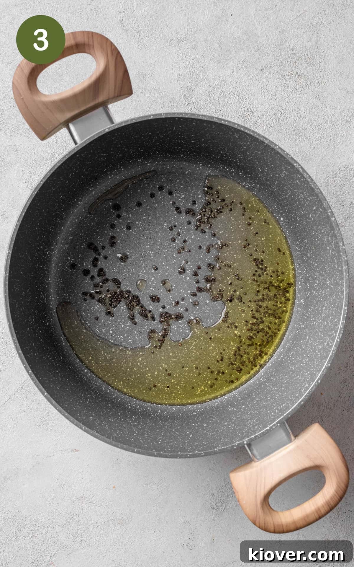 Oil and spices in a pan.