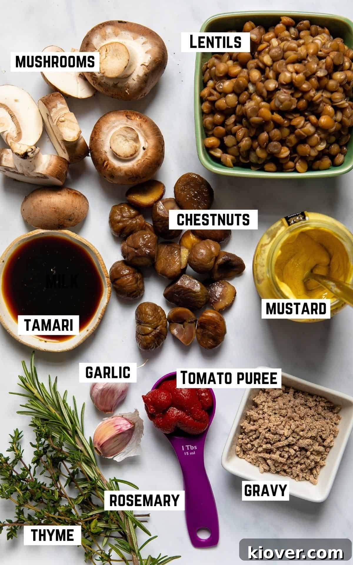 Effortless Lentil Wellington 3 ingredient flatlay with mushrooms, lentils, chestnuts, mustard, tamari, garlic, tomato puree, gravy, rosemary, and thyme, ready for making Lentil Wellington