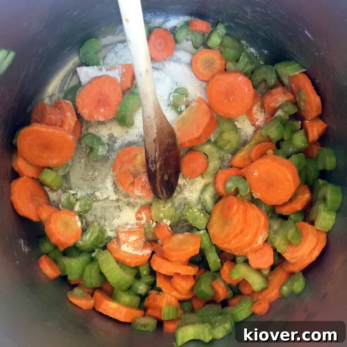 Carrots and celery simmering in a large pot, ready for the next step.