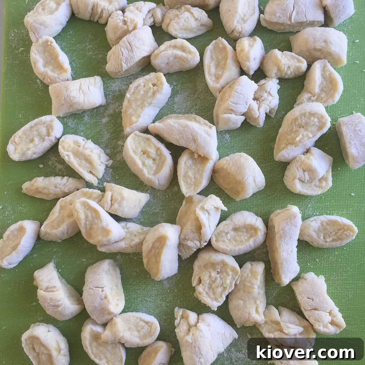 Neatly cut Knoephla dumplings resting on a surface, ready to be added to the soup.