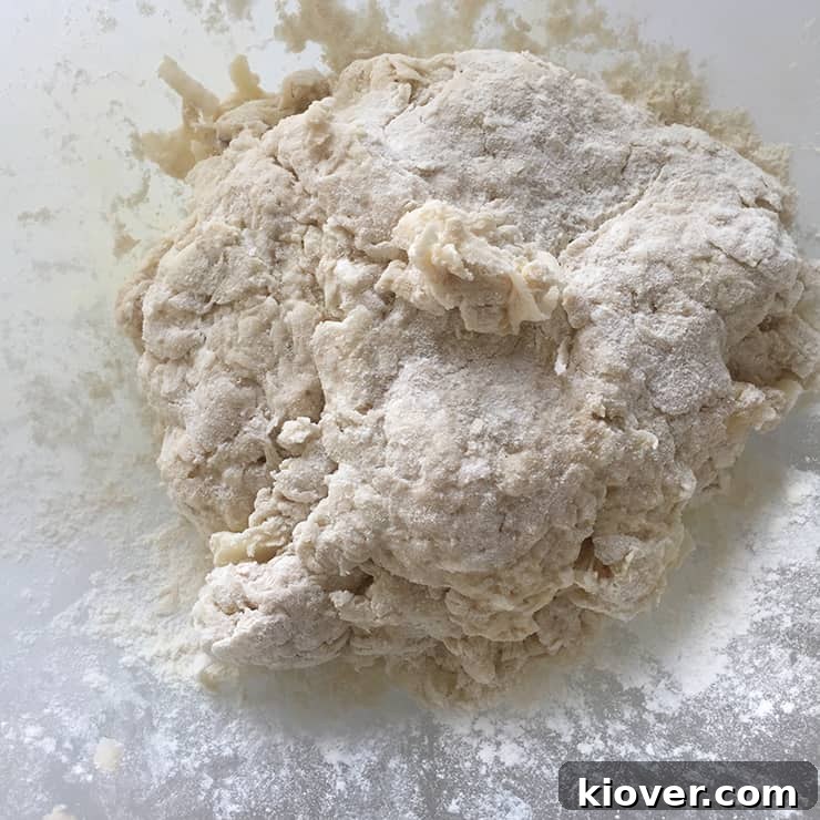 A close-up shot of mixed Klubb dumpling dough, showing its dense and firm consistency, ready for forming.