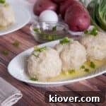 Three Klubb Dumplings with some of the ingredients in the background