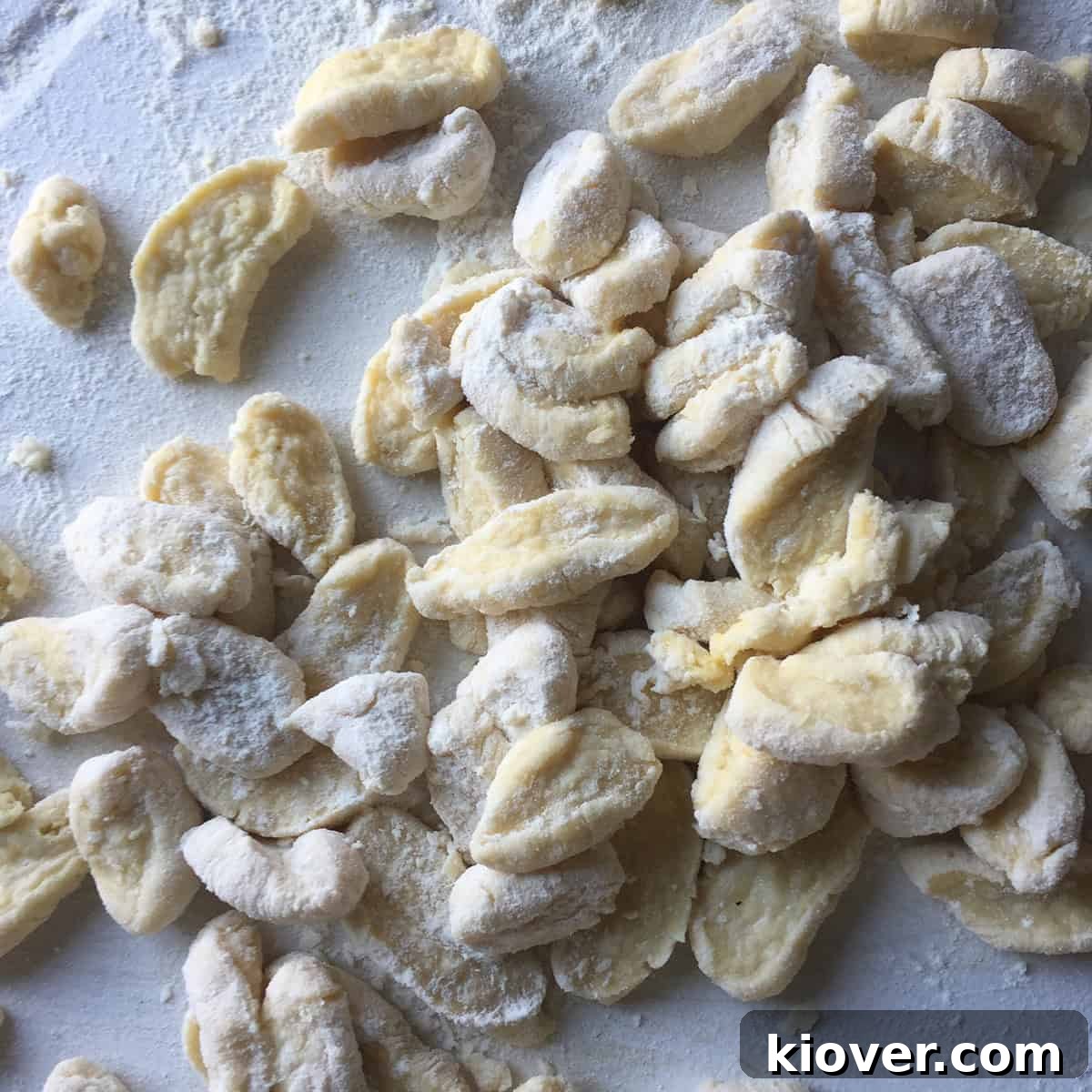 Raw knoephla dumplings with a light coating of flour, ready for boiling.