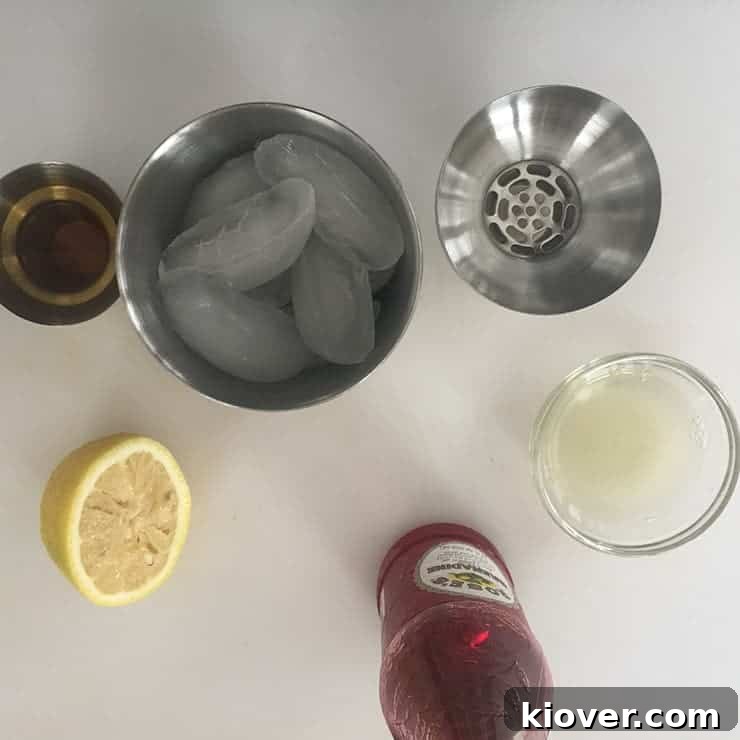 All the vibrant ingredients for a Jack Rose cocktail neatly arranged on a table, showcasing their freshness and quality before mixing.