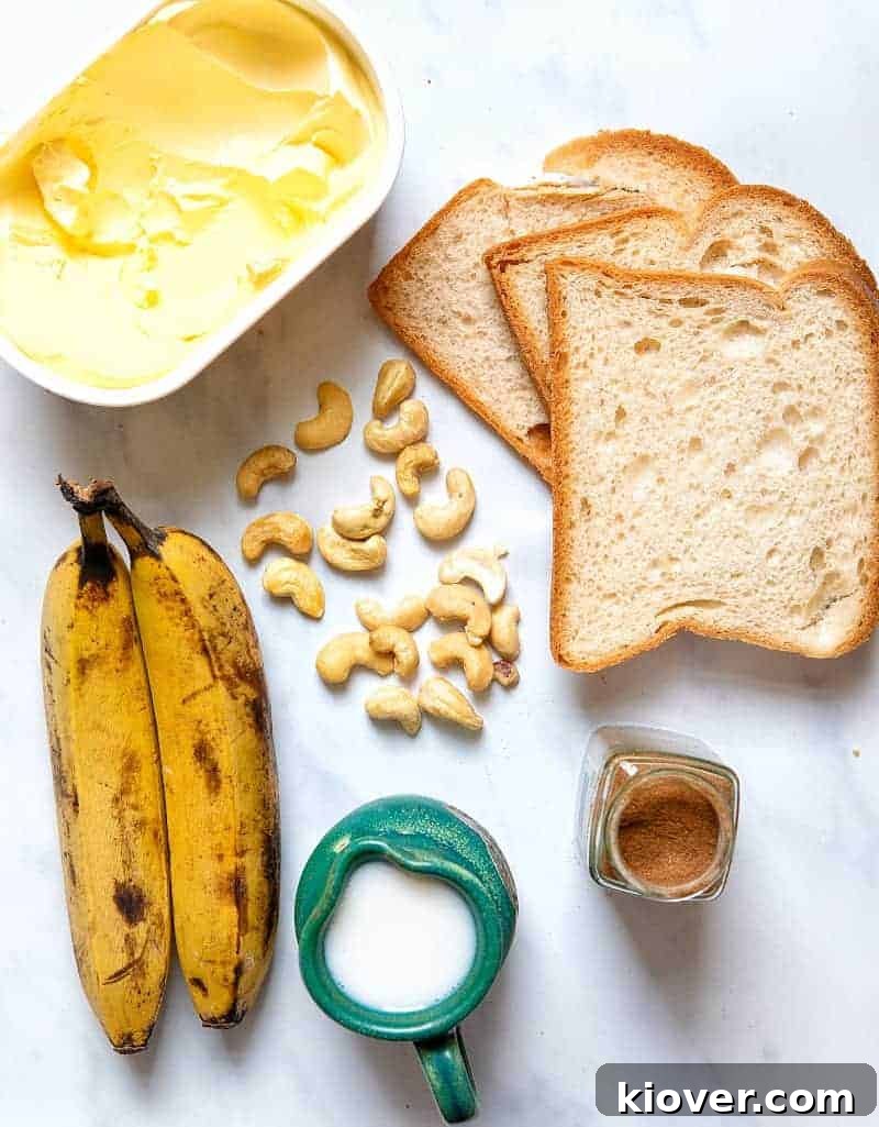 Essential ingredients for Free-From Banana Bread & Butter Pudding including ripe bananas, stale bread, cashews, dairy-free milk, and cinnamon
