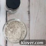 A batch of homemade celery salt and a bottle of celery seed on the side.