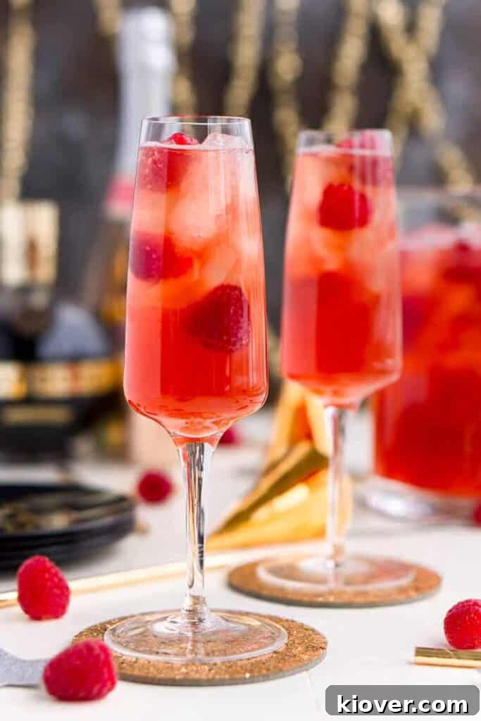 New Years Eve Champagne Punch, a sweet and fruity cocktail perfect for holiday celebrations.