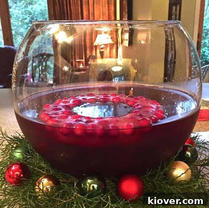Santa Claus Christmas Punch with a cranberry ice ring and Tequila, perfect for holidays.