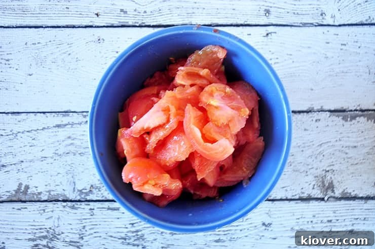 Peeled and cored tomatoes in a bowl, without their pulp or seeds.