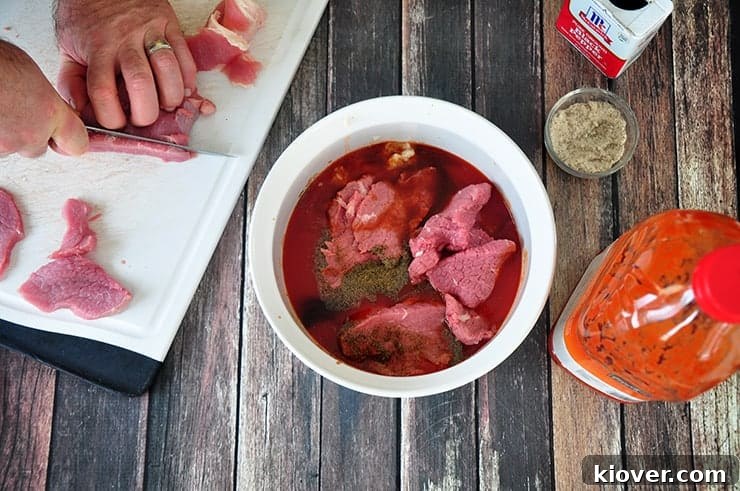 Marinating Beef Jerky Adding eye of round roast to beef jerky marinate.