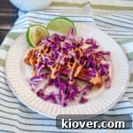 Beer Battered Fish Taco with cabbage and baja sauce.