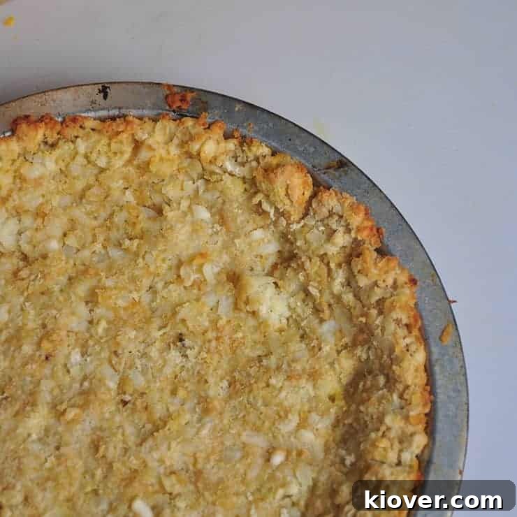 Baked Tater Tot Pie Crust before Meat Mixture has been put in pie tin.