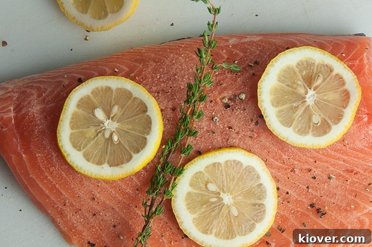 Lemon and thyme on salmon fillet.