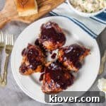 Four grilled chicken thighs with a Homemade BBQ Sauce Recipe.