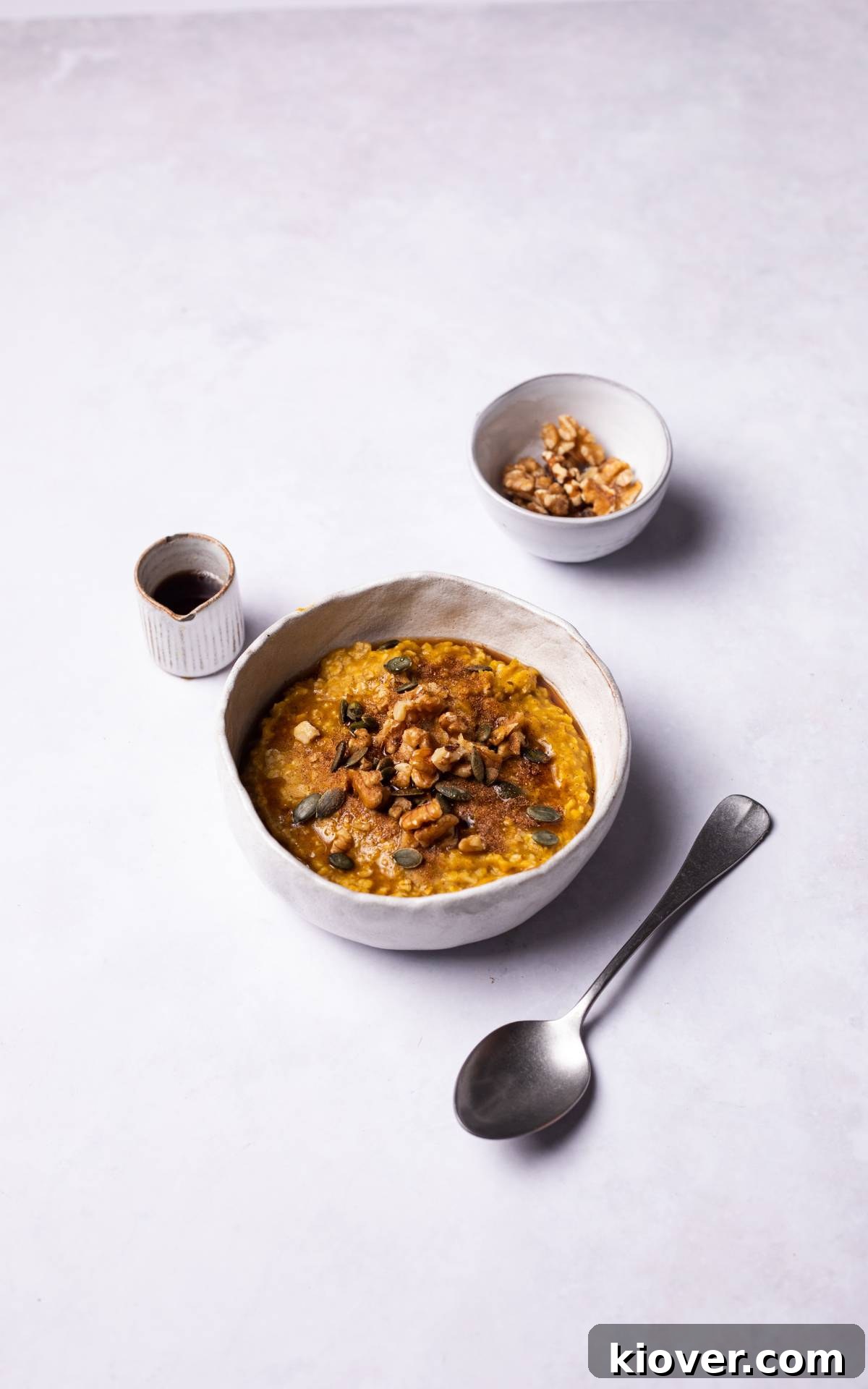 Golden Pumpkin Oat Bliss 8 A vibrant bowl of creamy pumpkin oatmeal, perfectly cooked and ready to be enjoyed.