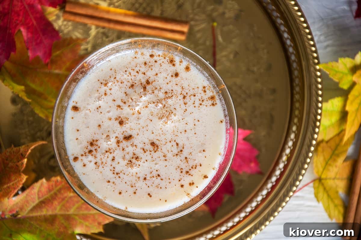 RumChataTini Cider cocktail on a gold platter. 