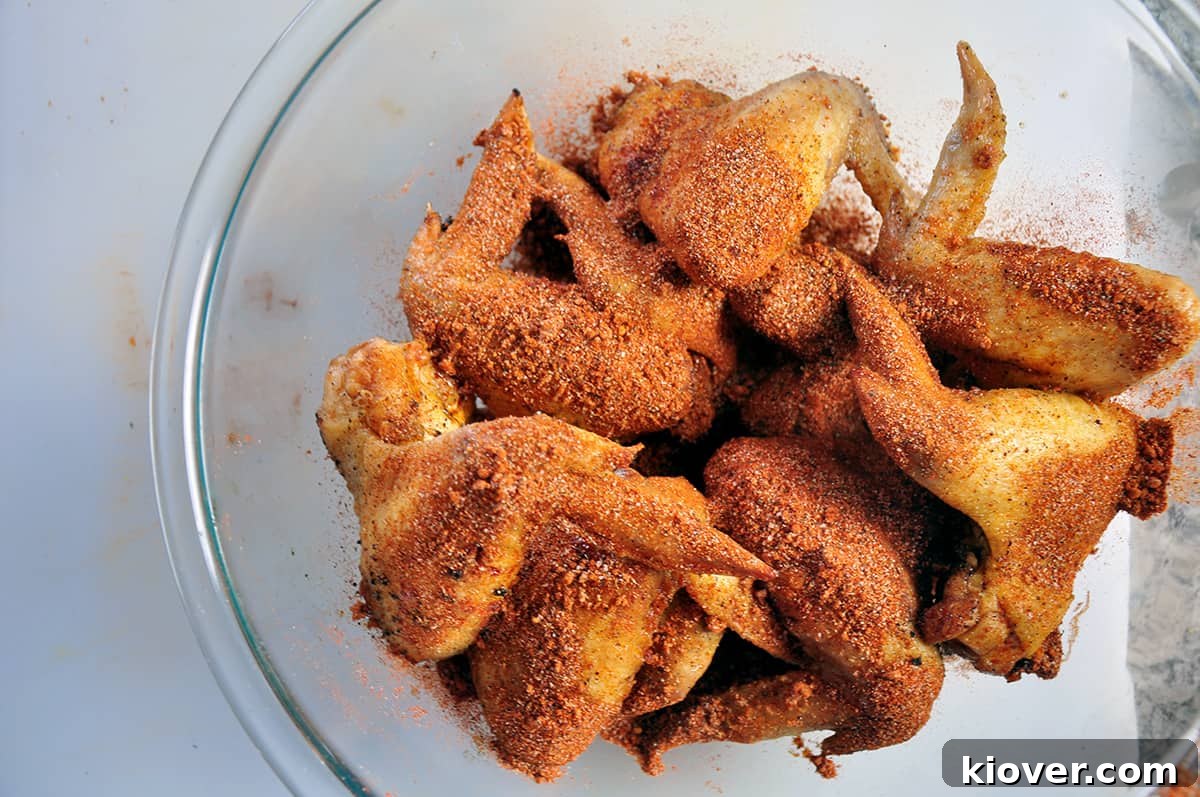Fried wings with dry rub sprinkled on top.