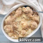 Overhead view of a casserole dish of Cauliflower Au Gratin Casserole, perfectly browned and bubbly.