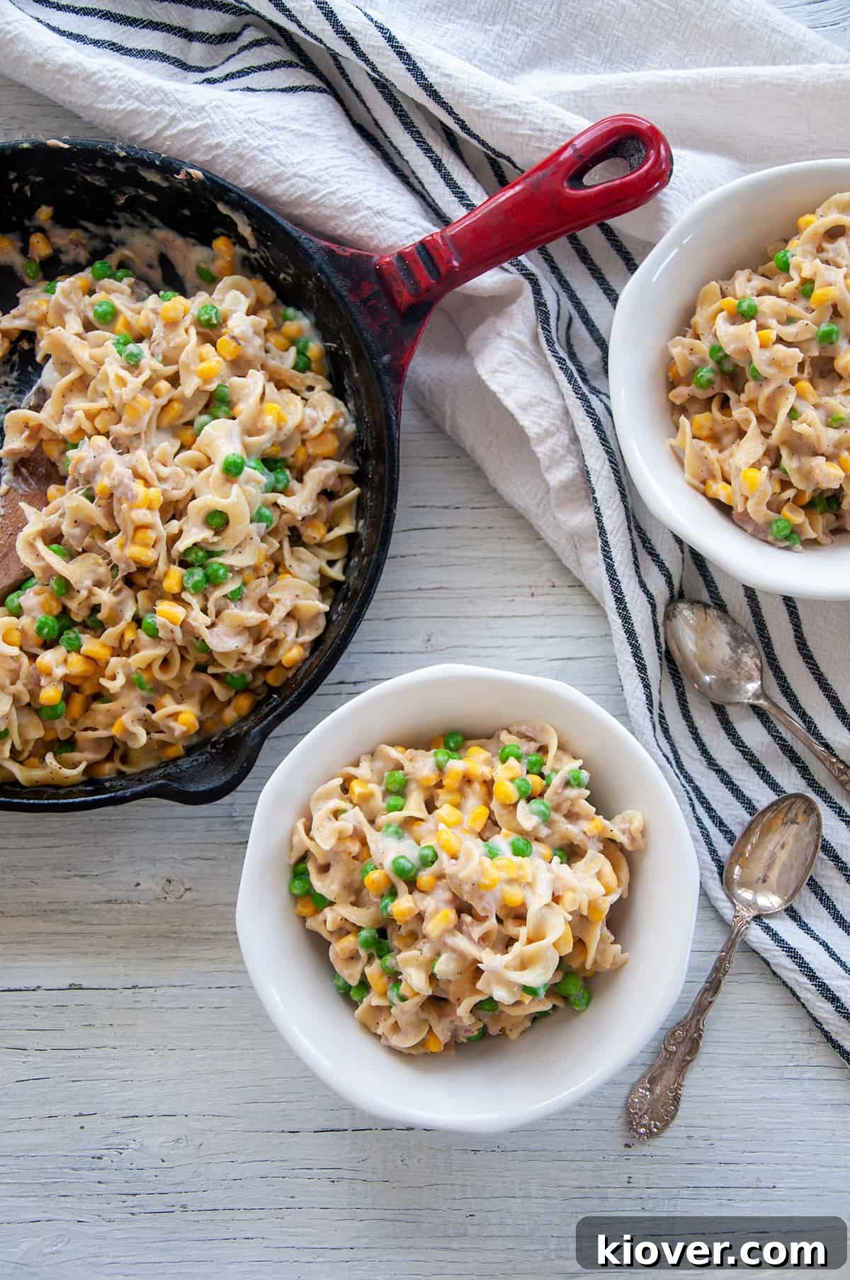 Quick Homemade Tuna Pasta Skillet 3 Homemade Skillet Tuna Helper Recipe in two white bowls with the remaining in a red cast iron skillet.